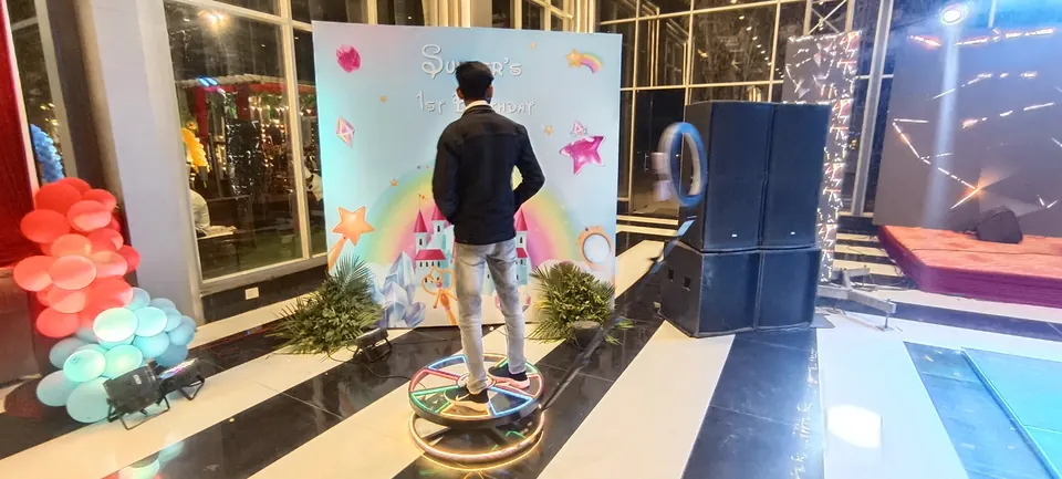 Guest standing on a 360 booth platform during a Jaipur celebration