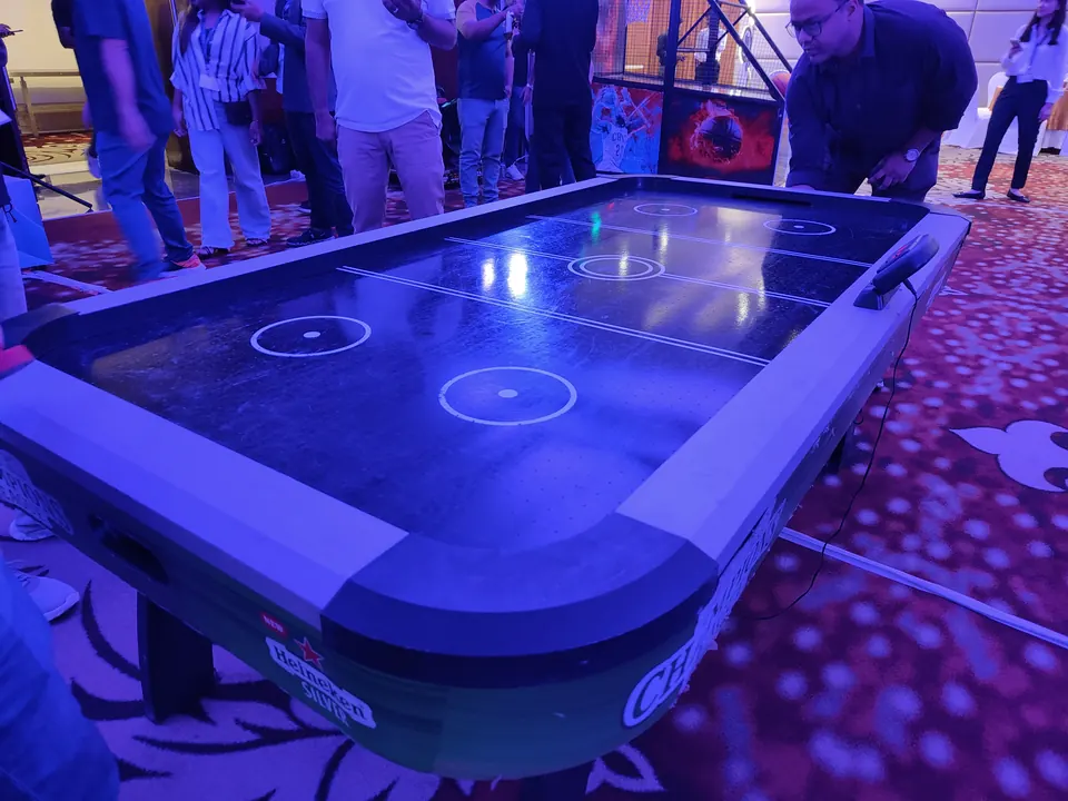 Black air hockey table for corporate guest engagement in Lucknow