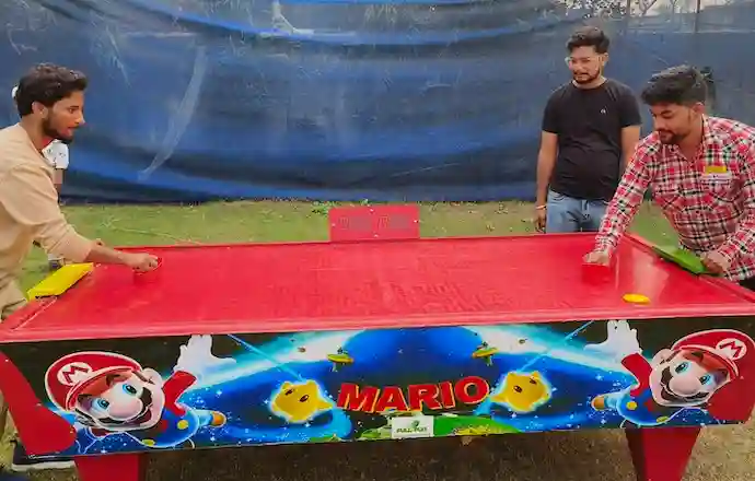 Air hockey game table ready for party guests in Noida