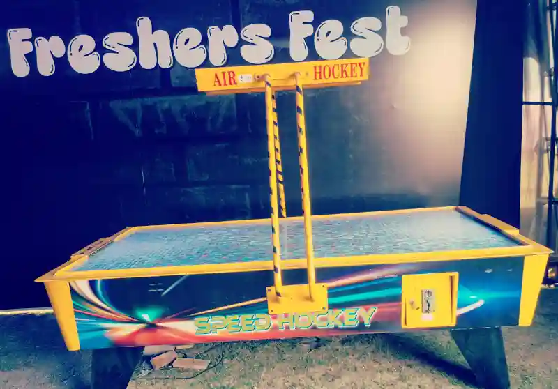 Guests playing air hockey at a Mumbai celebration