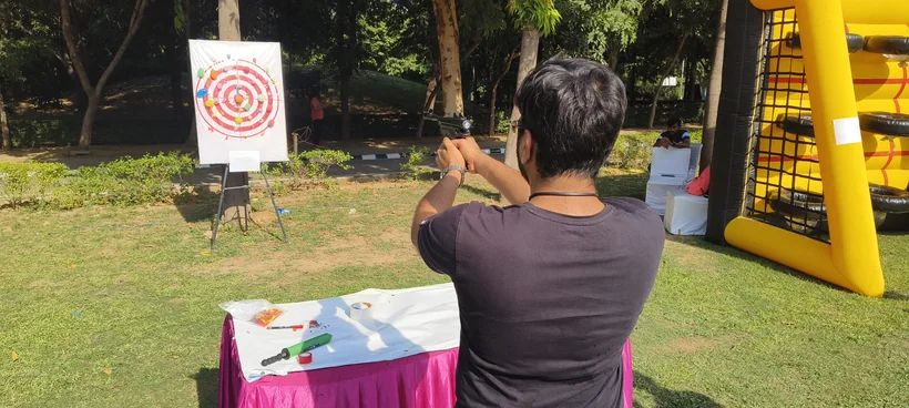 Outdoor balloon shooting activity set up for a celebration in Lucknow