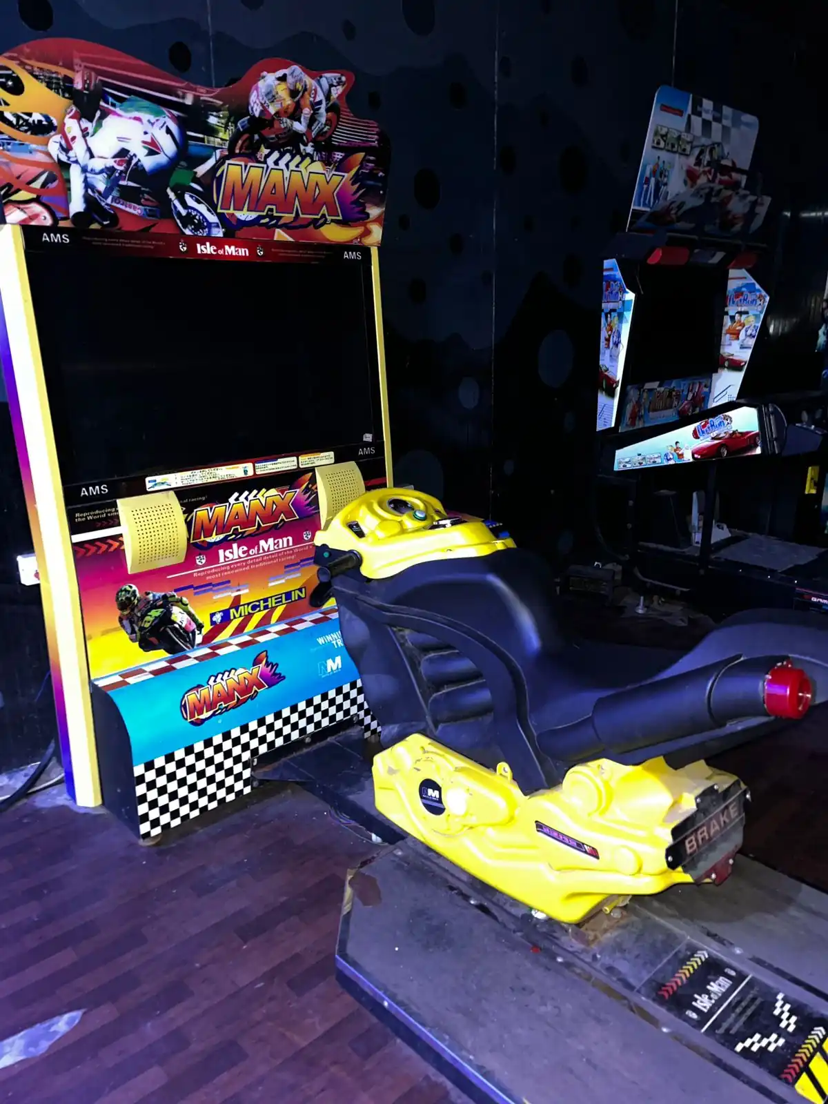 Side view of a bike racing arcade machine ready for guest play in Jaipur