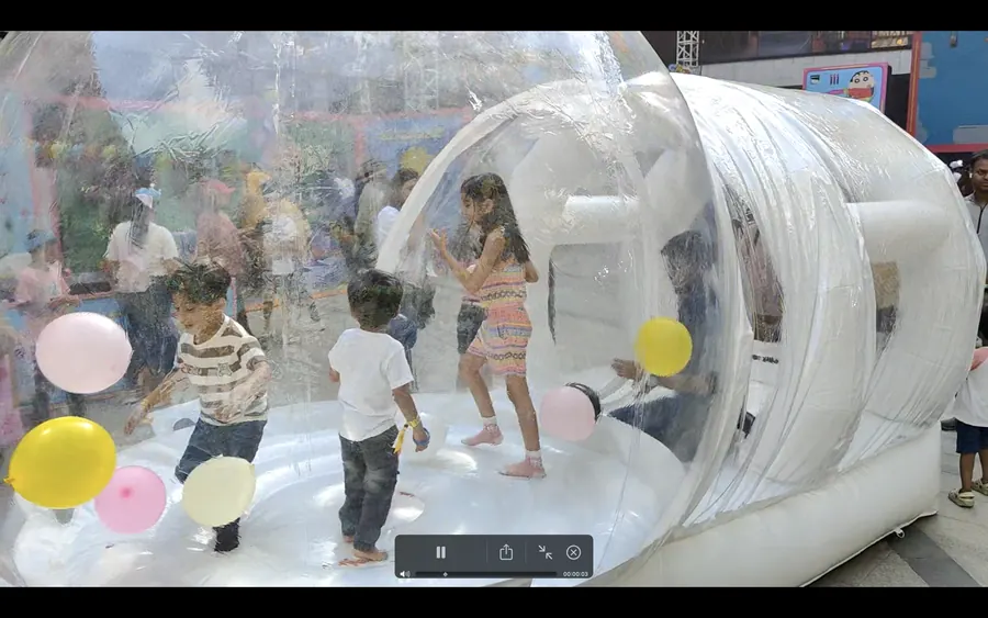Guests enjoying bubble house during a Noida celebration