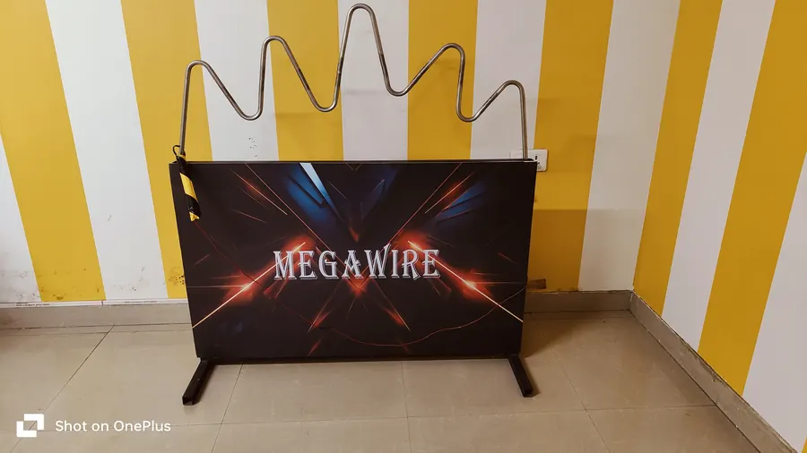 Guests enjoying buzz wire game during a Noida celebration