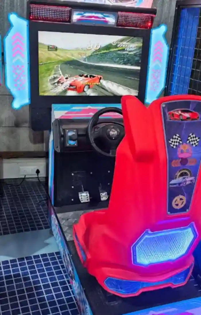 Arcade racing machine ready for guest play in Noida