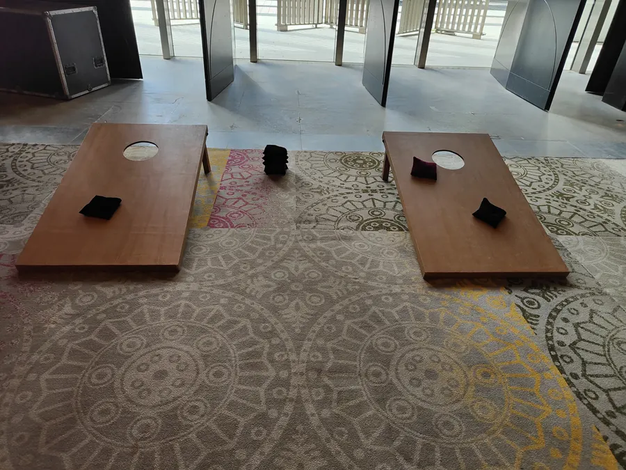 Guests playing Cornhole game at a corporate event in Mumbai
