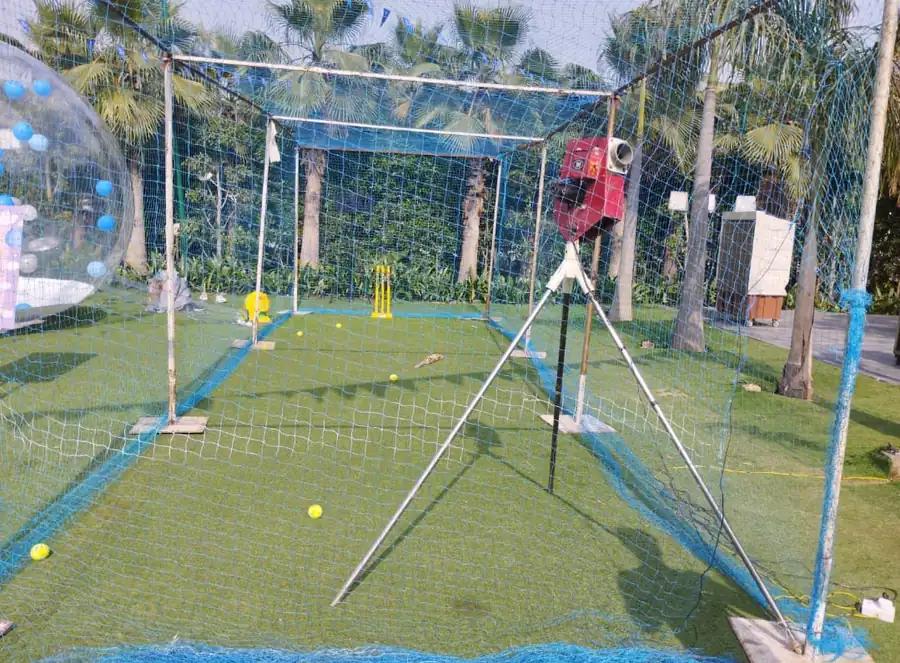 Guests enjoying cricket bowling machine during a Lucknow celebration