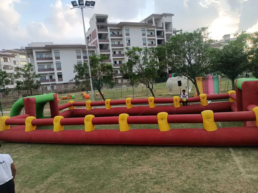 Full-size inflatable human foosball arena set up outdoors for a Mumbai event