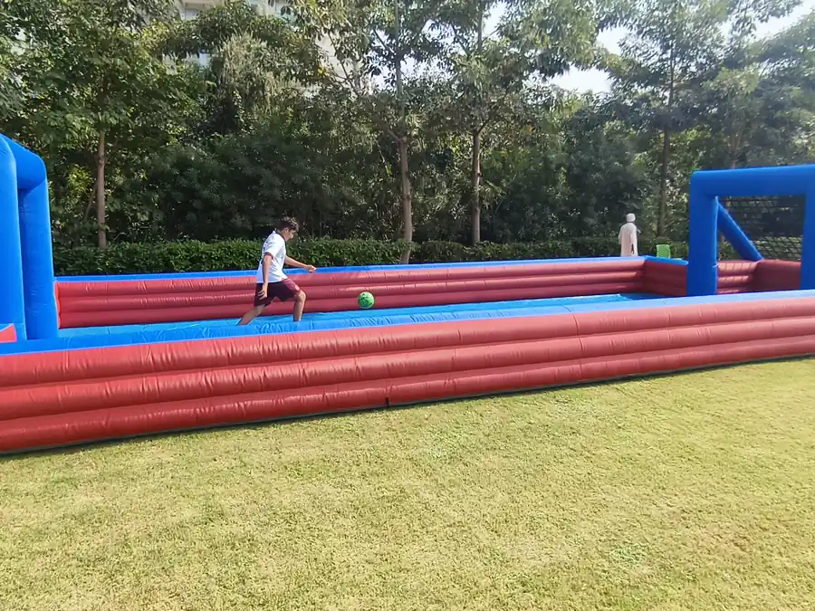 Guests enjoying slippery football game during a Goa celebration