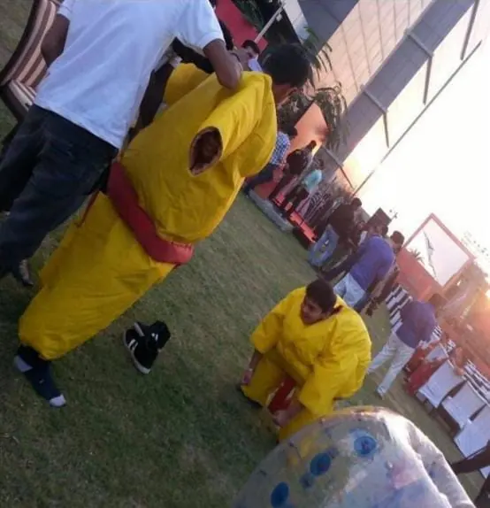 Guests competing in padded sumo suits