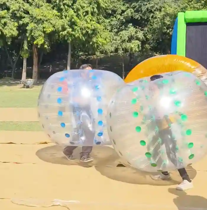 Guests enjoying zorbing balls at an event
